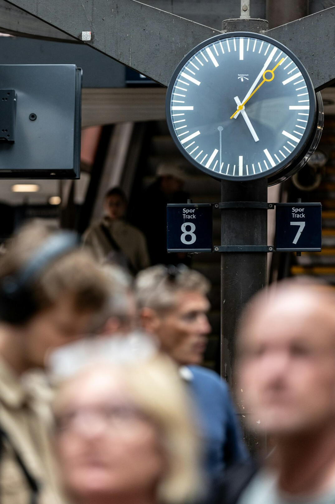 Commuters queuing on a platform at Odense train station