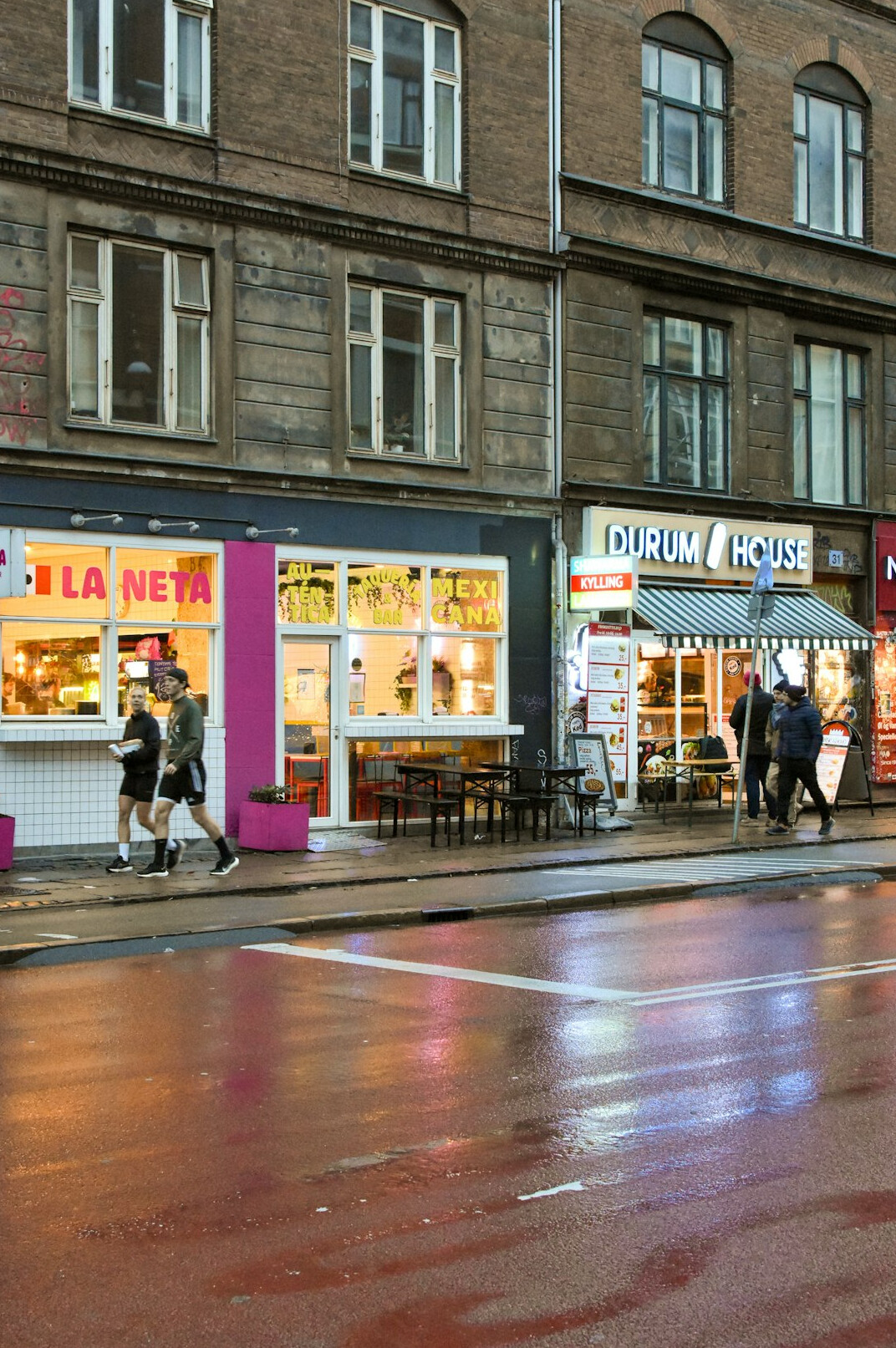Shoppers queuing outside a discount grocery store in Nørrebro, Copenhagen